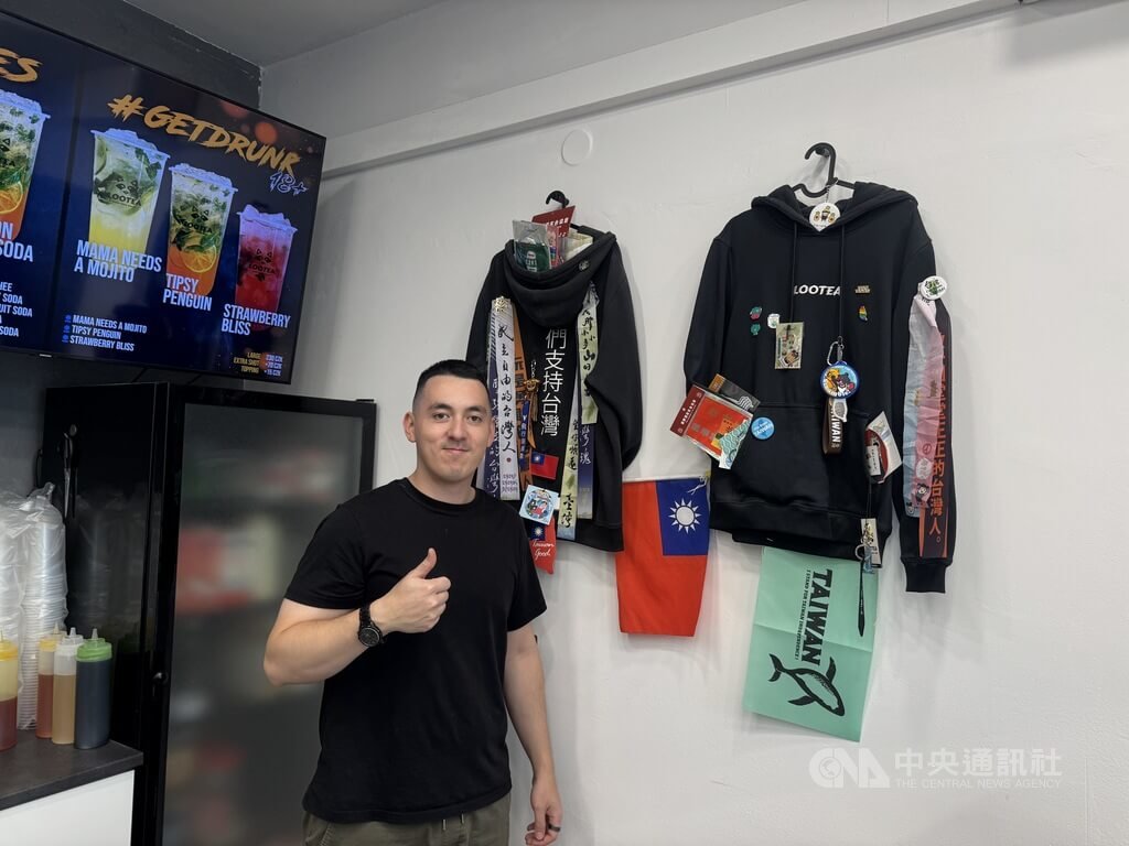 Patrik at Lootea beside hoodies, gifts and messages supporting Taiwan.